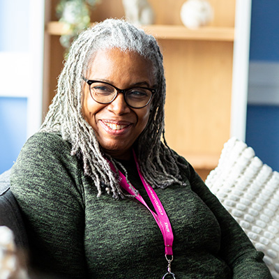 staff member smiling at camera